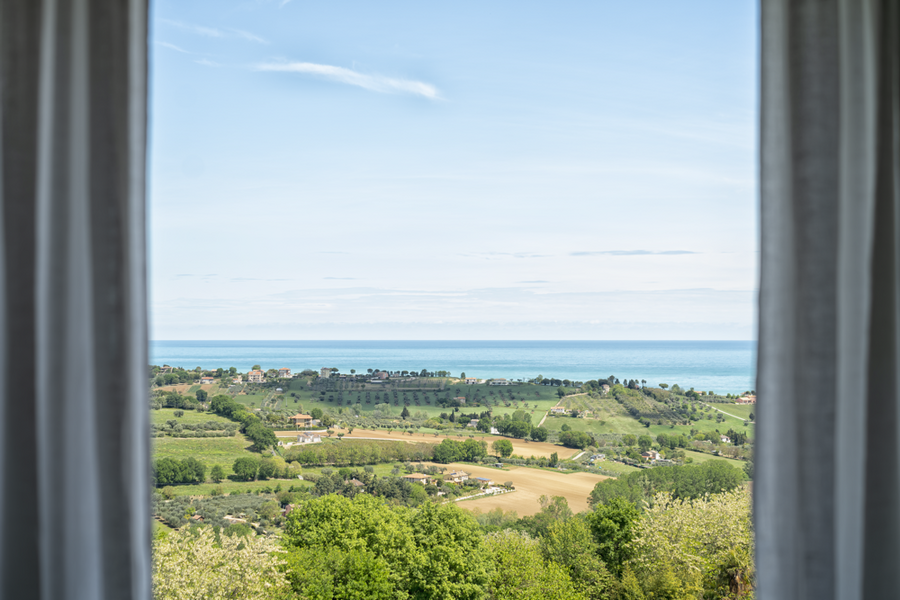 Rolling hill view from bedrooms Villa Olivo Photo credit Davide Bischeri