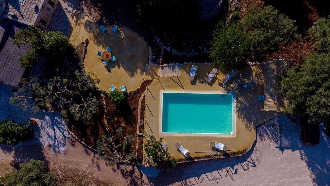 Trulli-of-stars-drone-close-up-swimming-pool