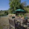 Outdoor table with private pool in the country villa Bottino in Lucca