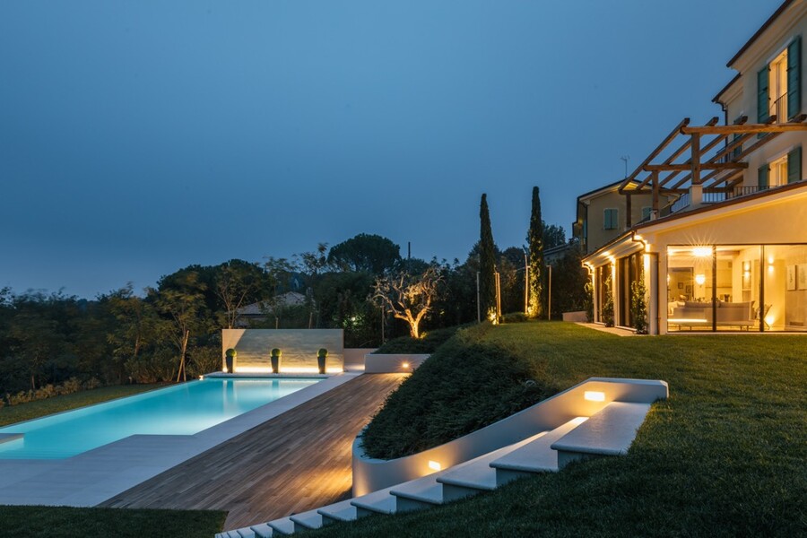 Side view of villa & pool at night  Villa Olivo Photo credit Andrea Volpini